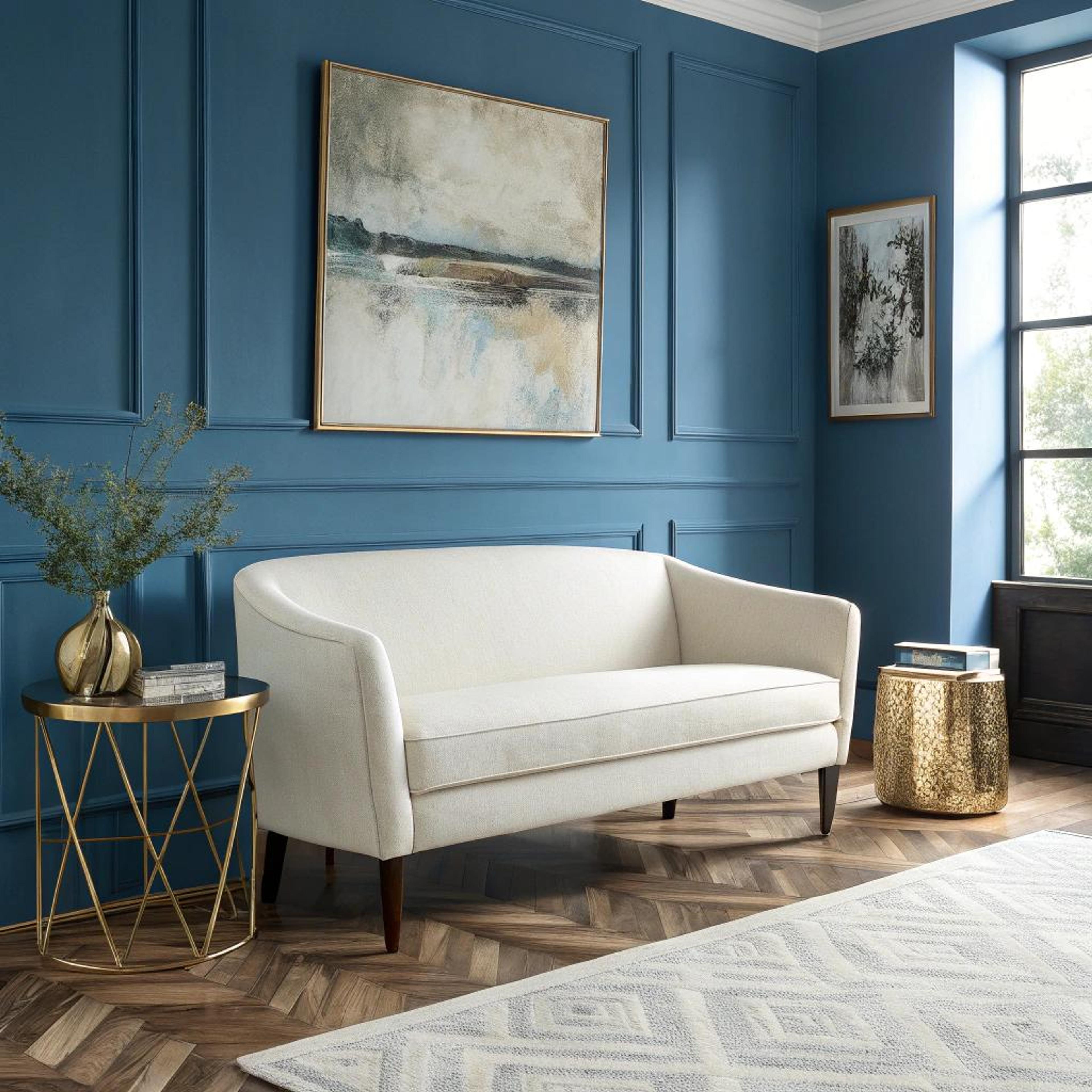 Crèmekleurige zitbank met blauw contrast