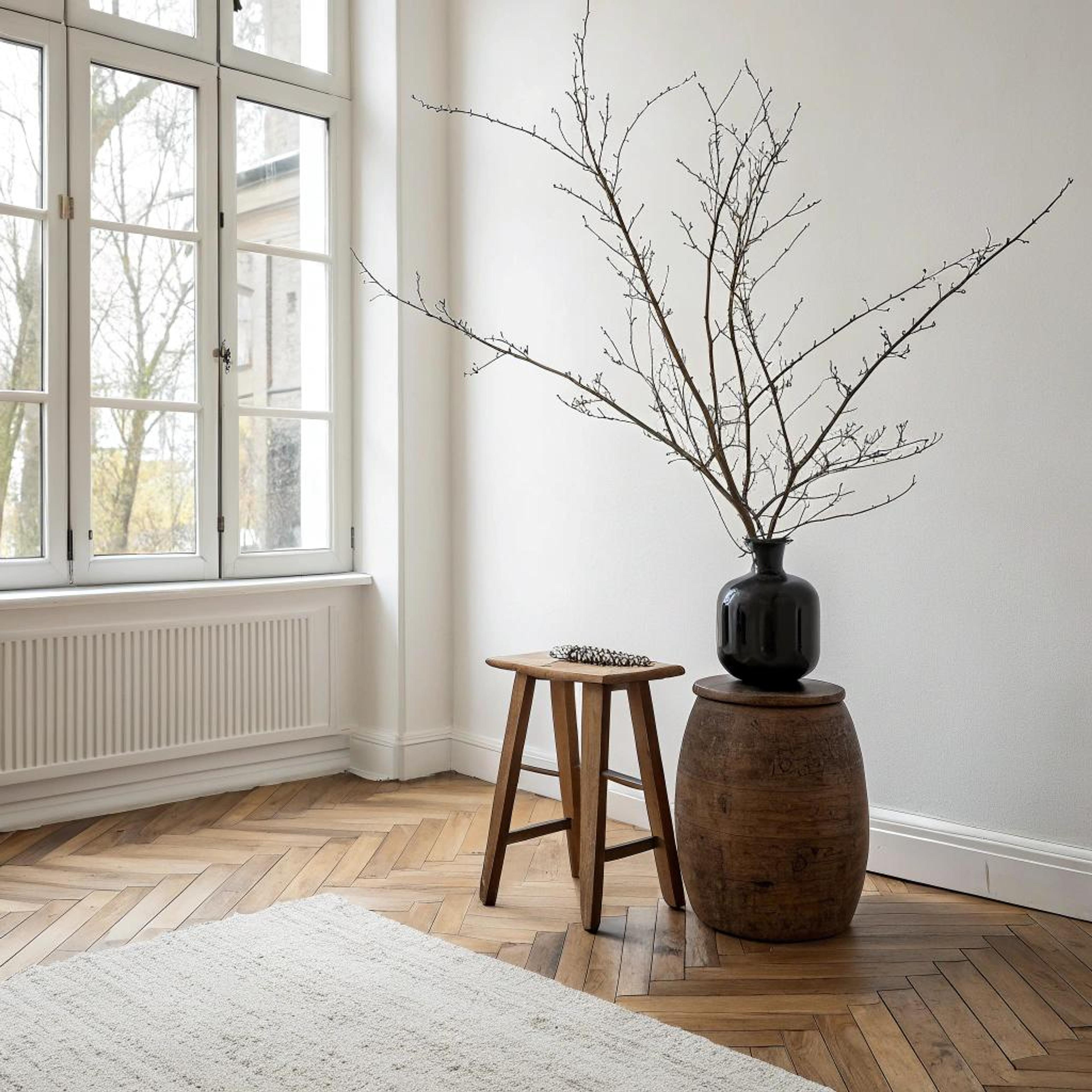 Vloerkleed layering met chevronvloer