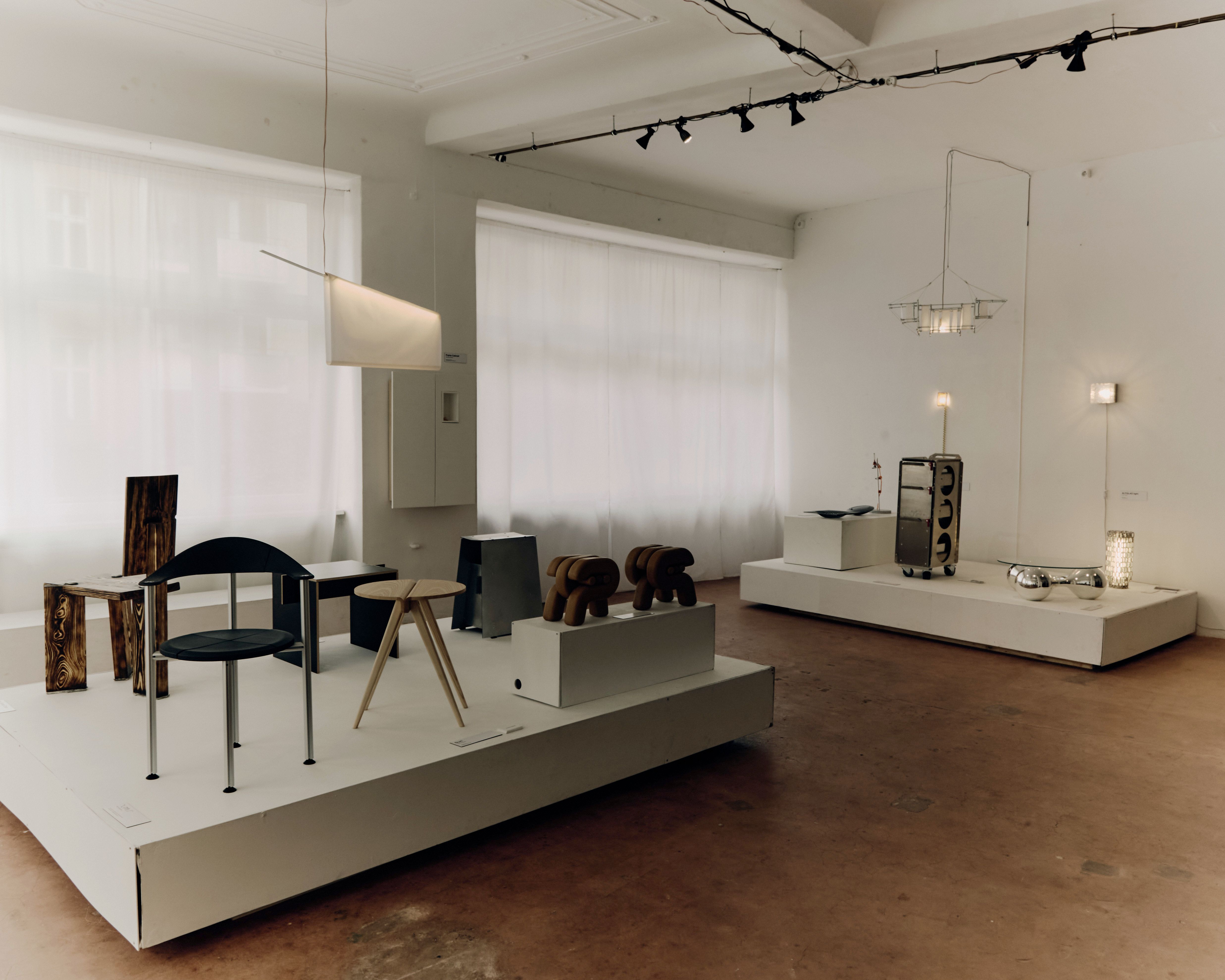 Two podests with stools and other furniture objects