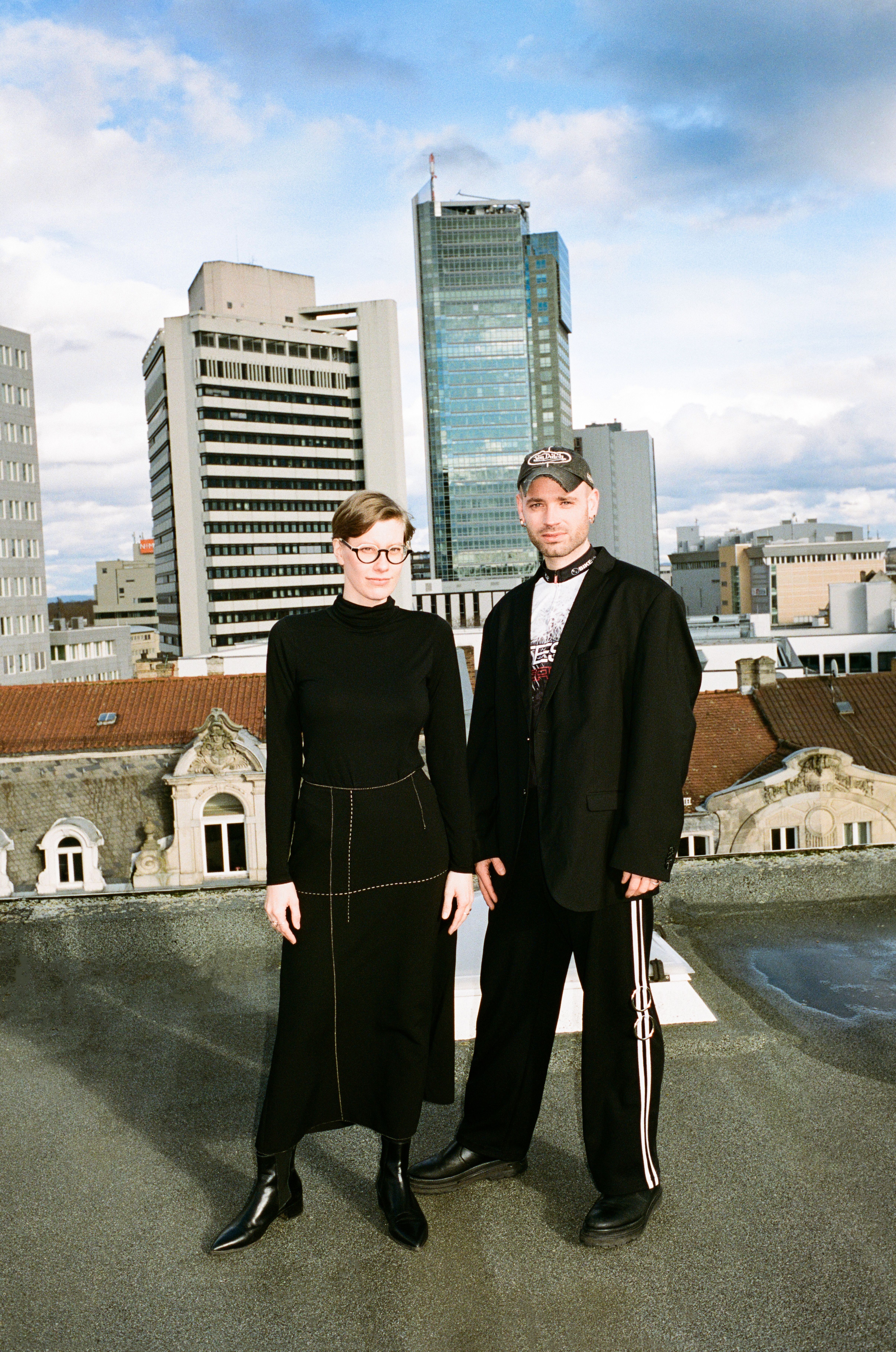 Nina Sievering and Anton Rahlwes in front of a city skyline