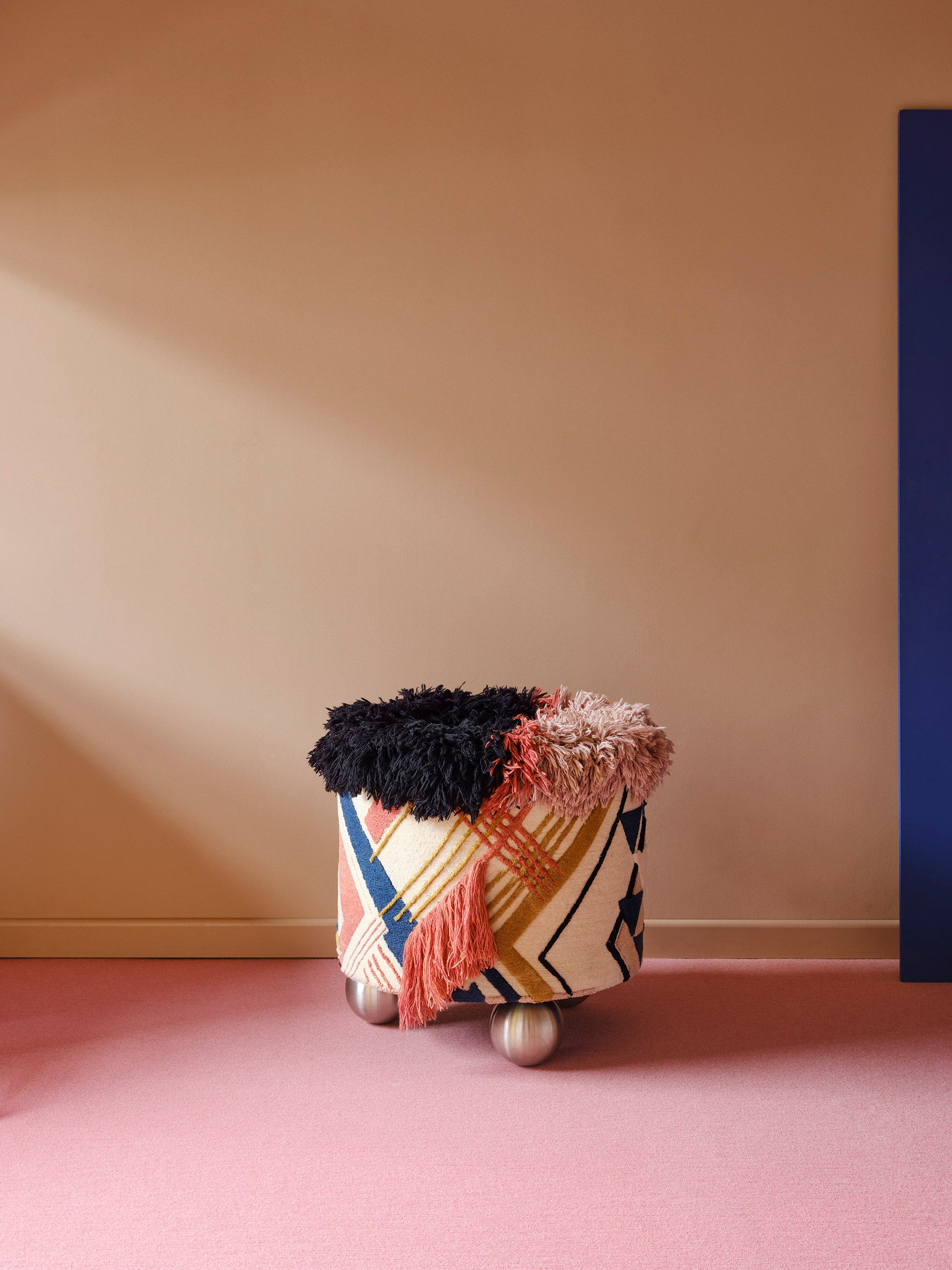 a textile object on a pink floor