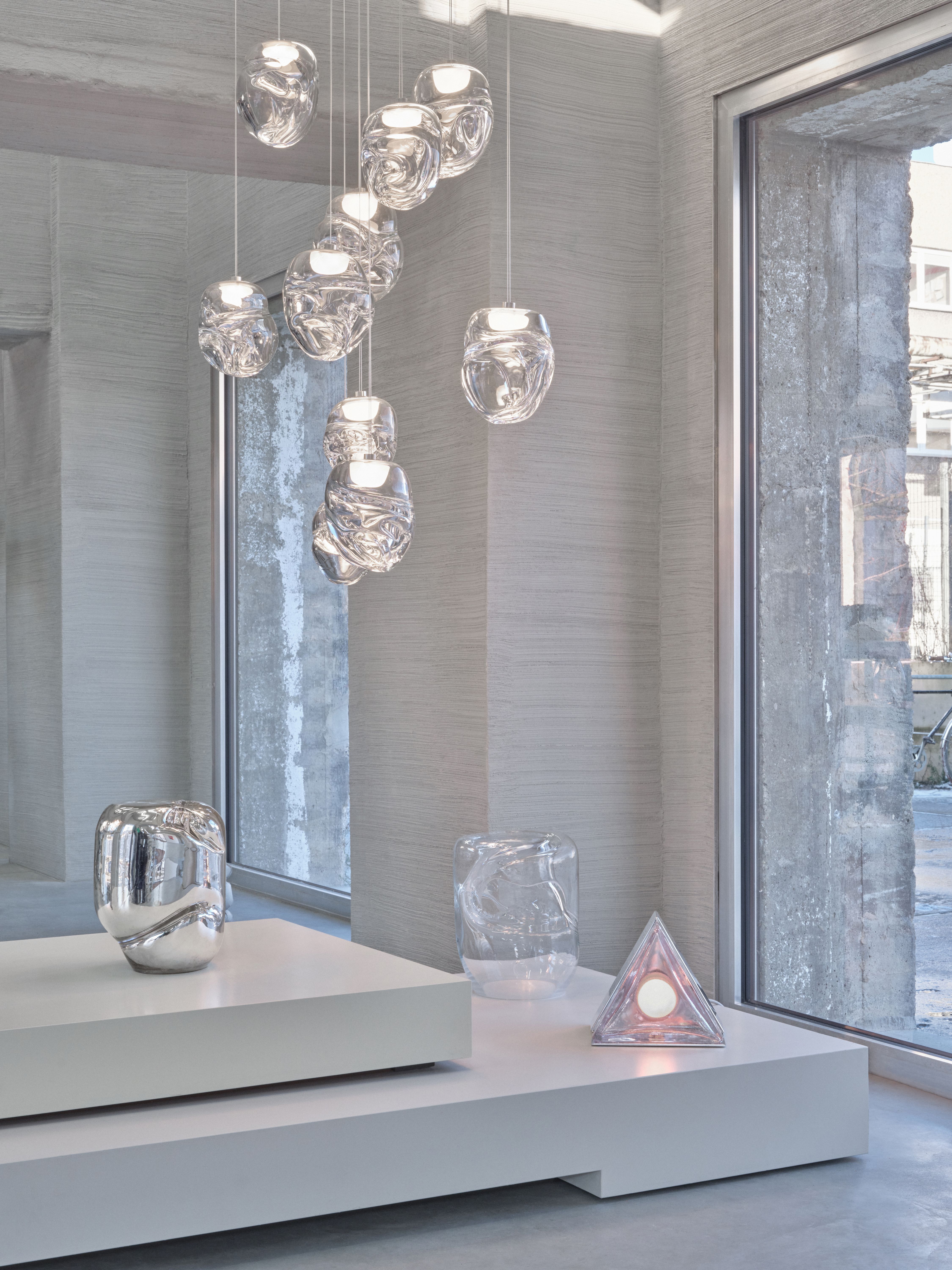 Lights and side tables made from glass in a industrial environment