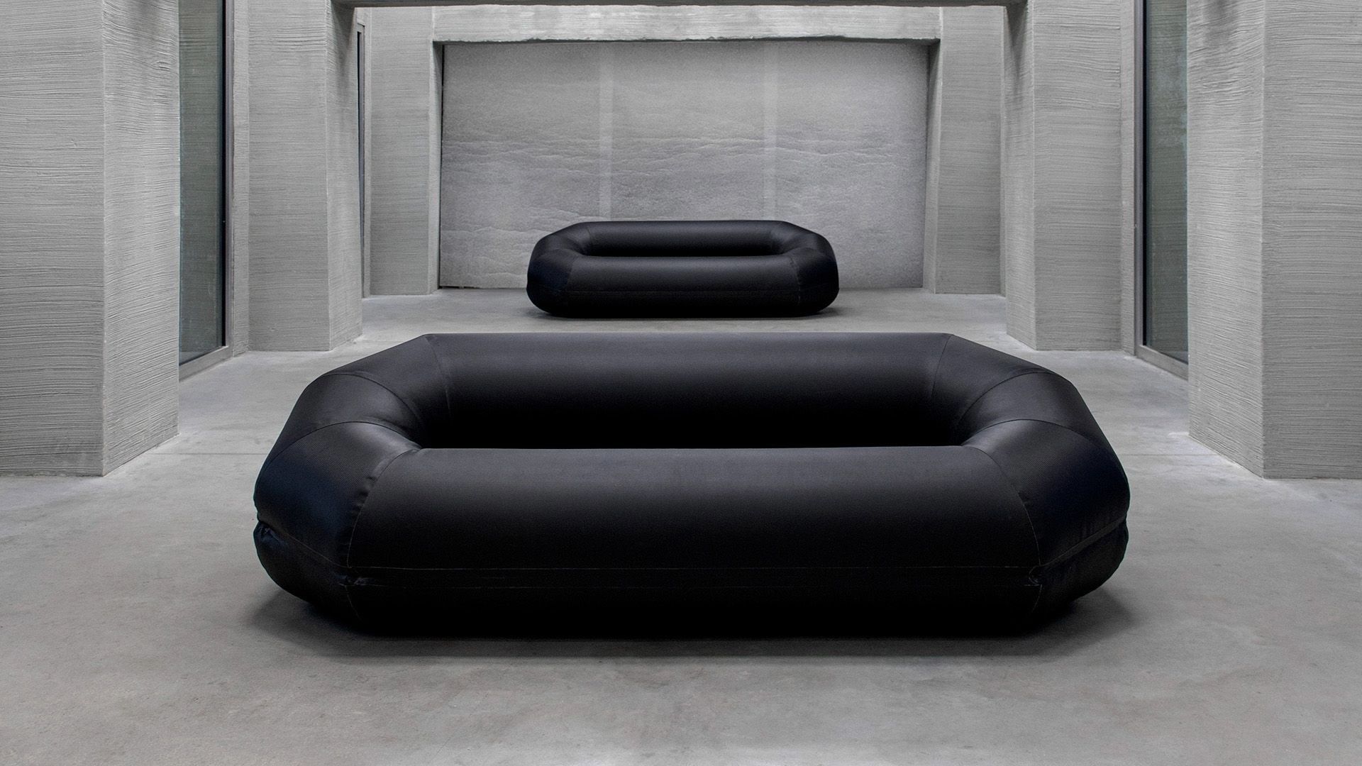 A rubber sofa in front of a mirror