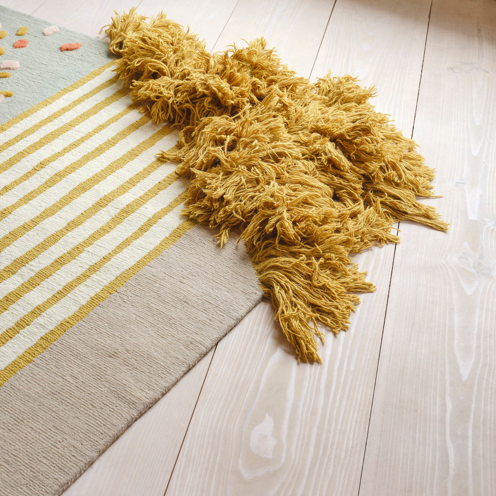 A carpet on a wooden floor