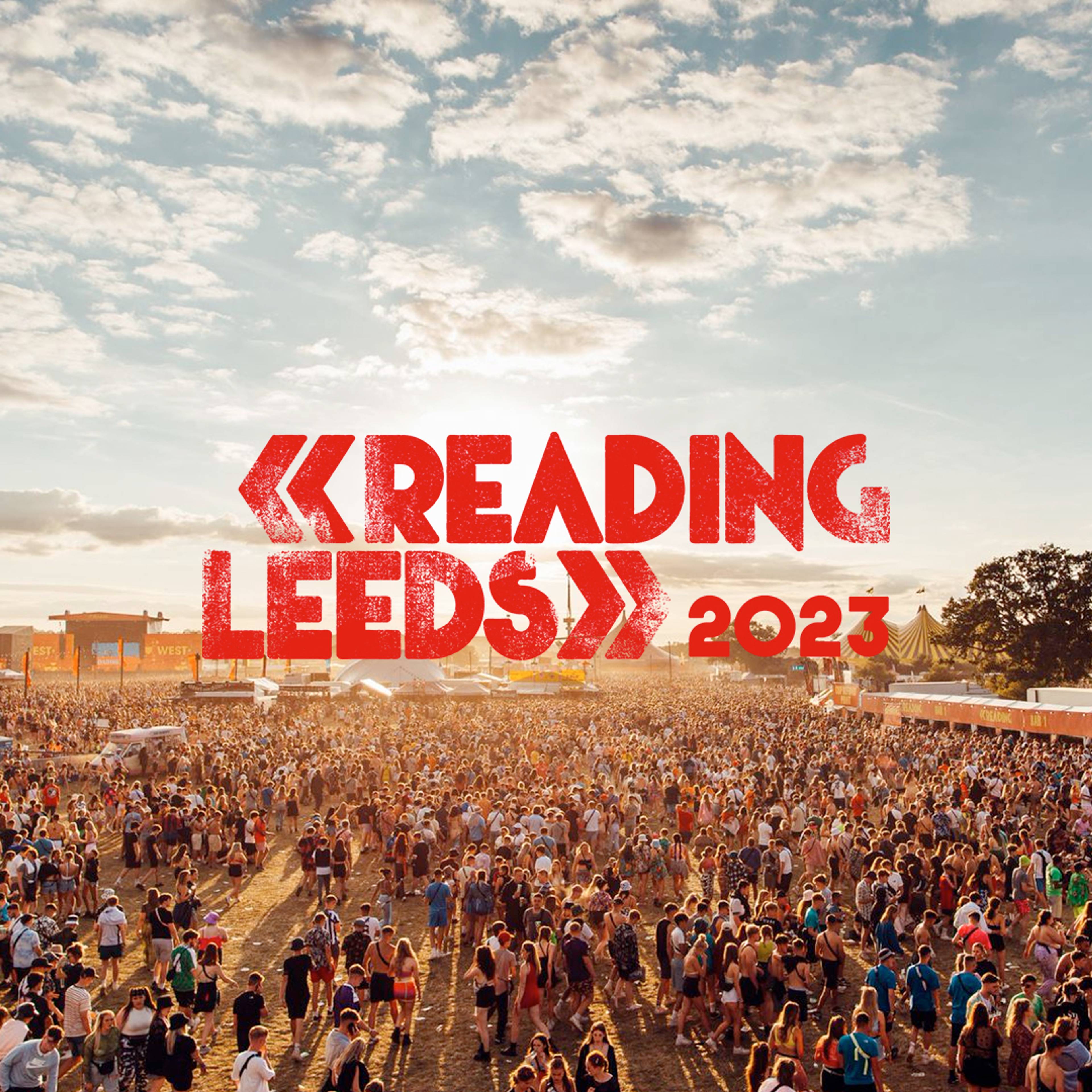 Festival crowd in the day behind the Reading and Leeds 2023 logo