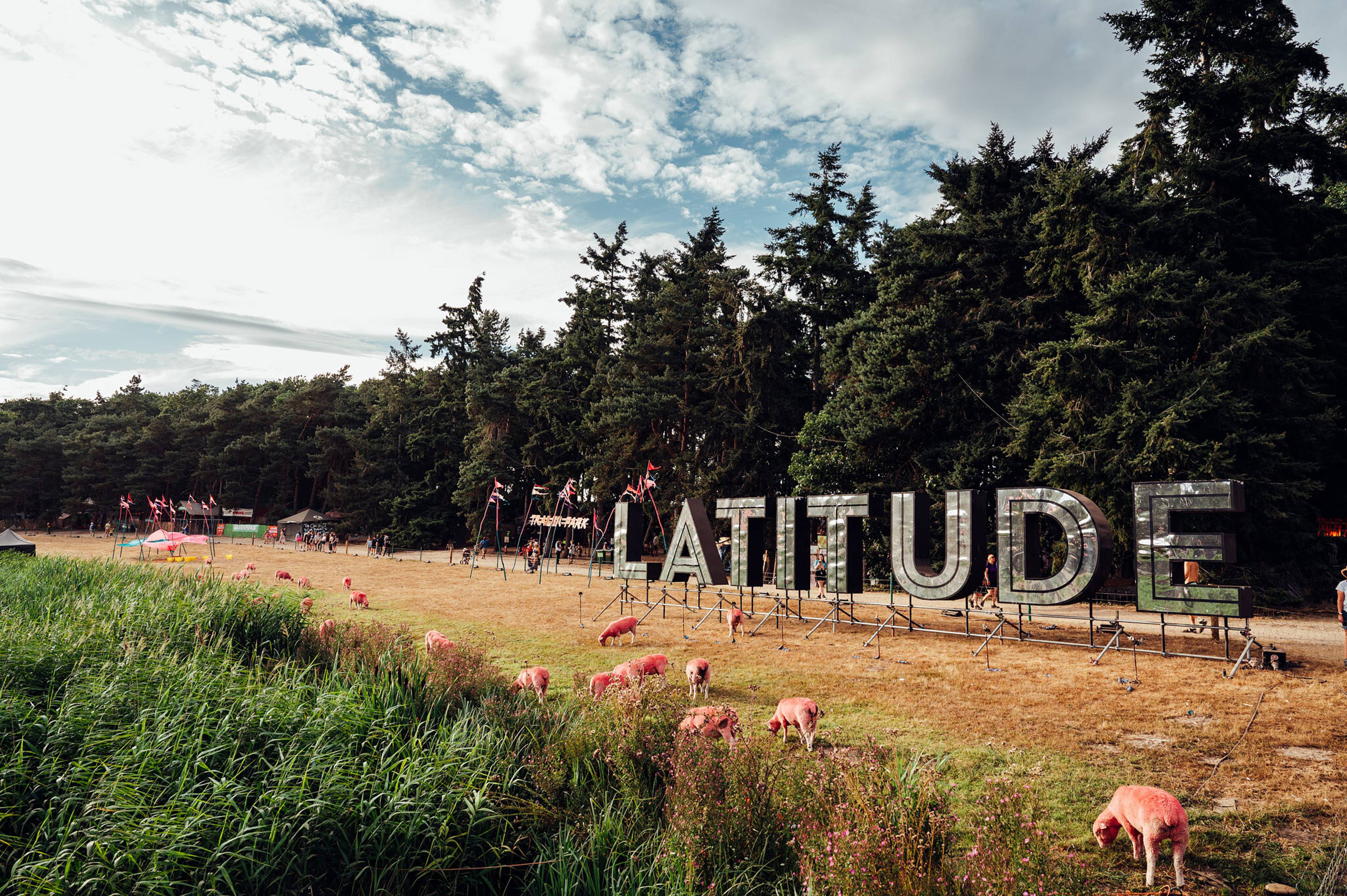 'Latitude' festival sign in a field with sheep
