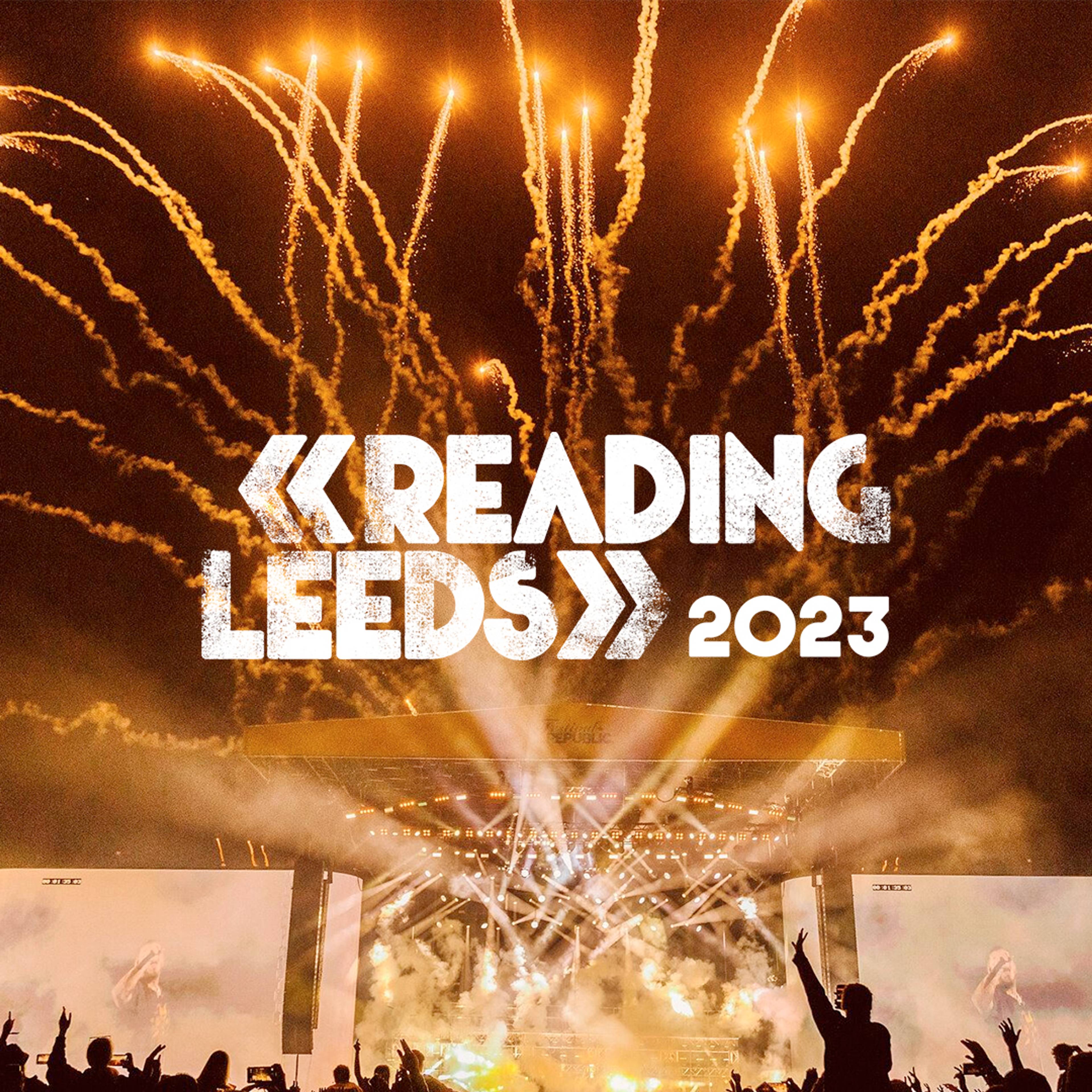 Festival stage at night with fireworks behind the Reading and Leeds 2023 logo