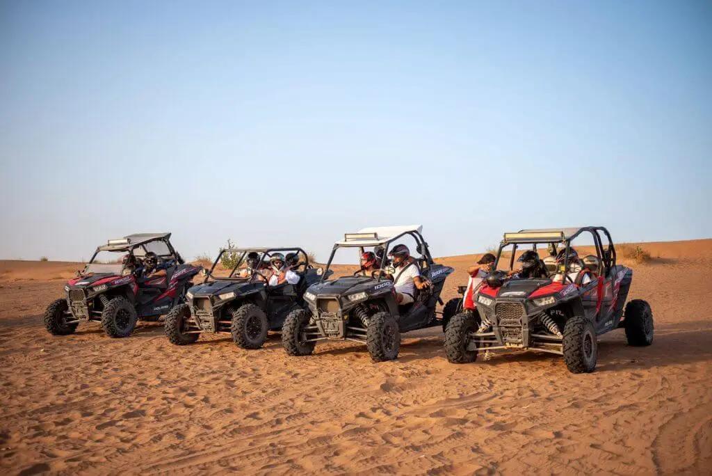 Solo rider driving a single-seater dune buggy in the desert