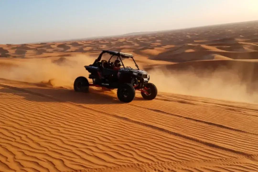Guide leading a group of buggies across the desert