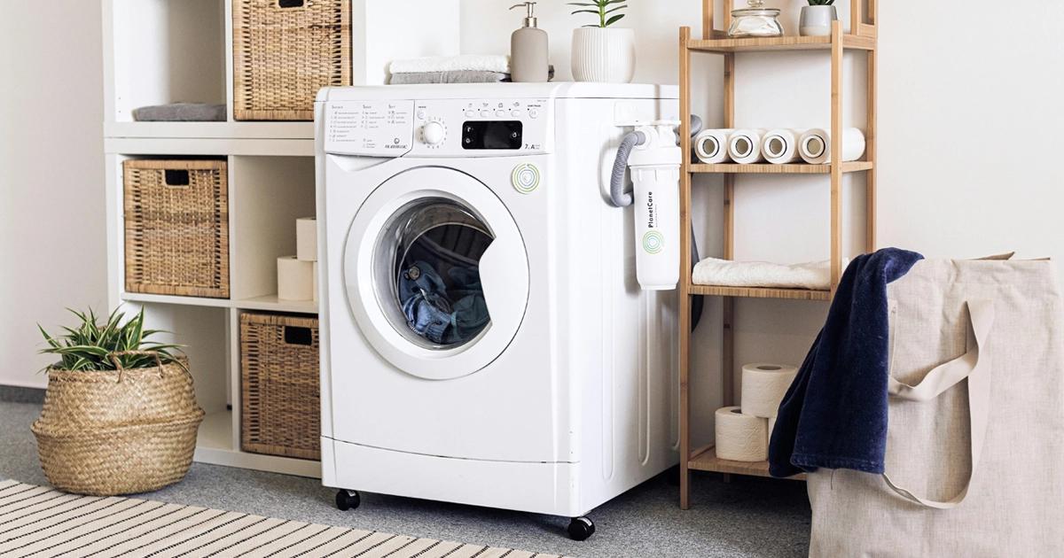 "Tru Earth laundry strips next to a plastic detergent bottle"