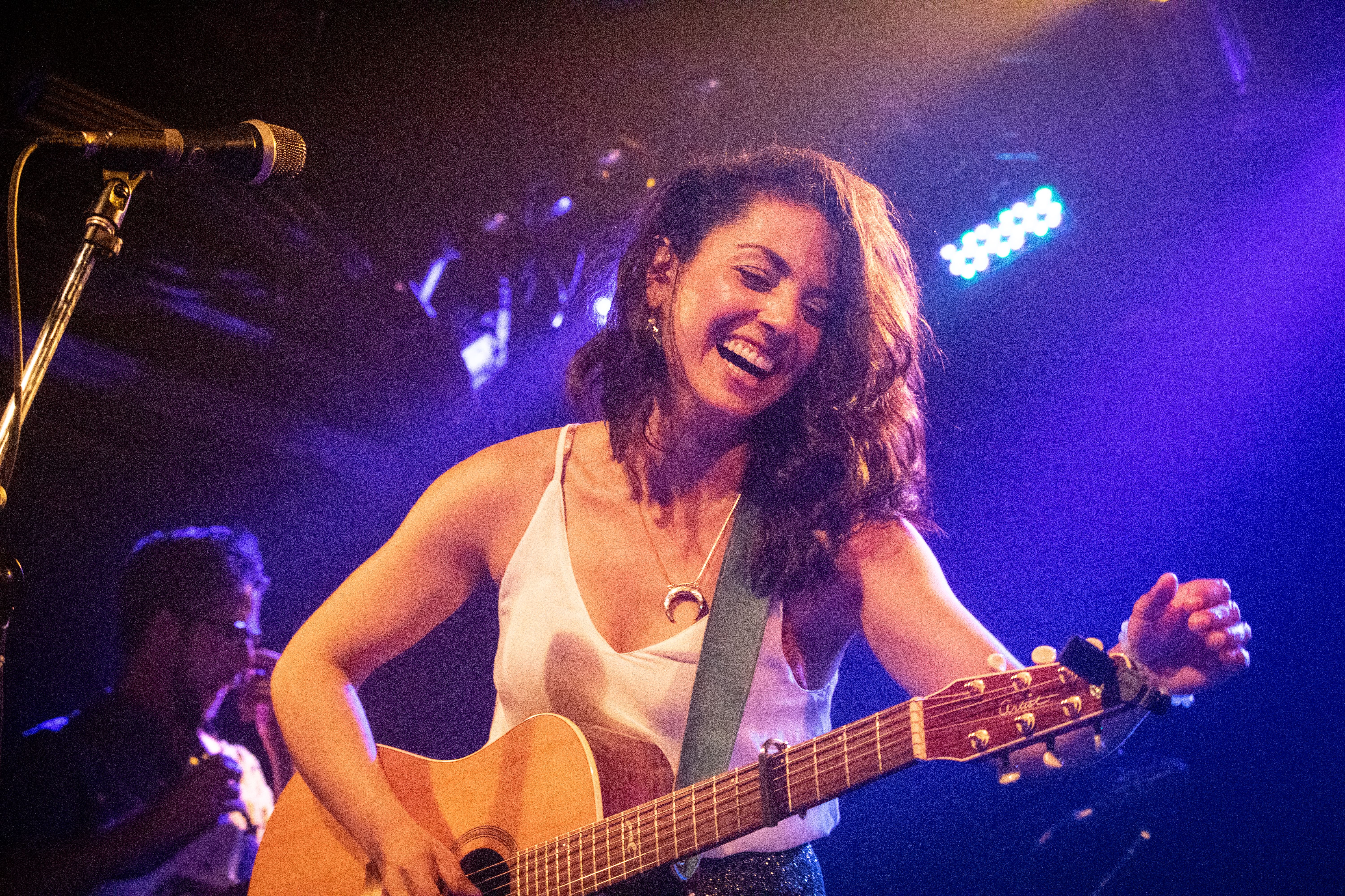 Naghmeh tuning her guitar