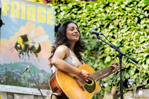 Naghmeh performing outdoors at Fringe Folk 2019