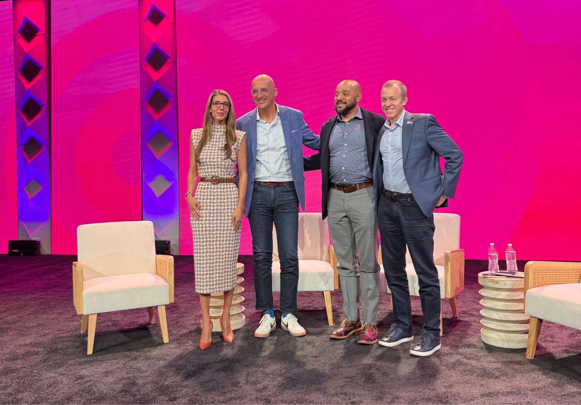 Group of people posing on a stage