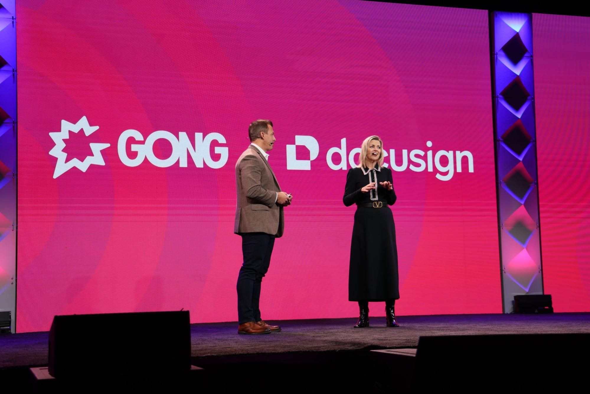 Man and woman standing on stage