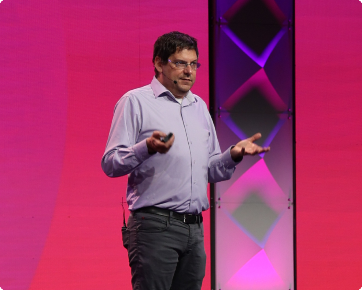Man standing on stage giving a speech