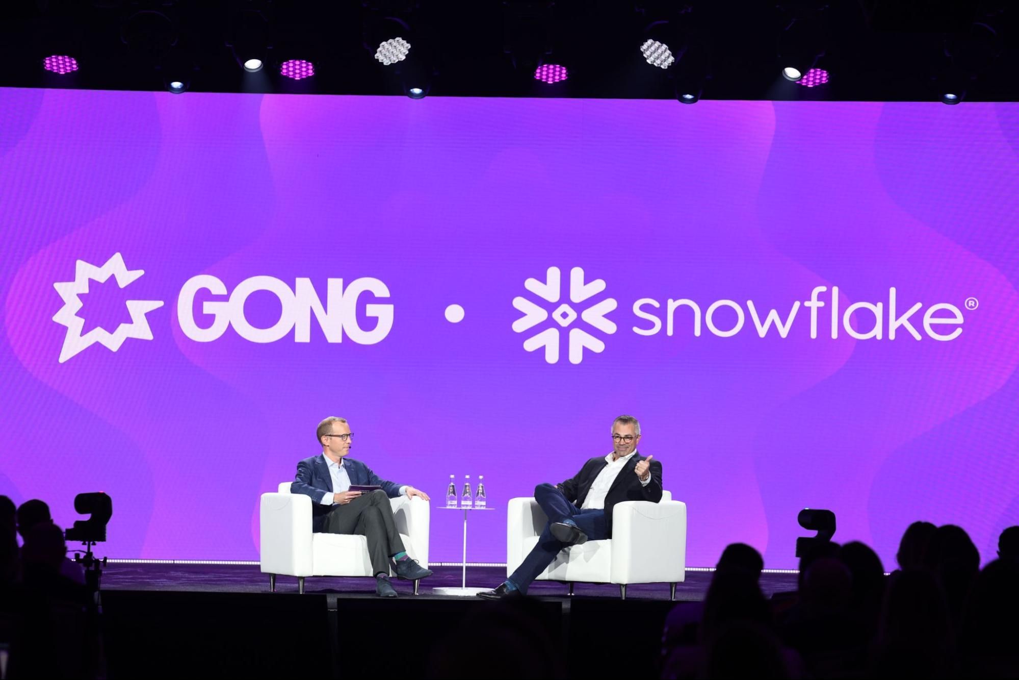 Someone from Gong and someone from Snowflake sit on a stage