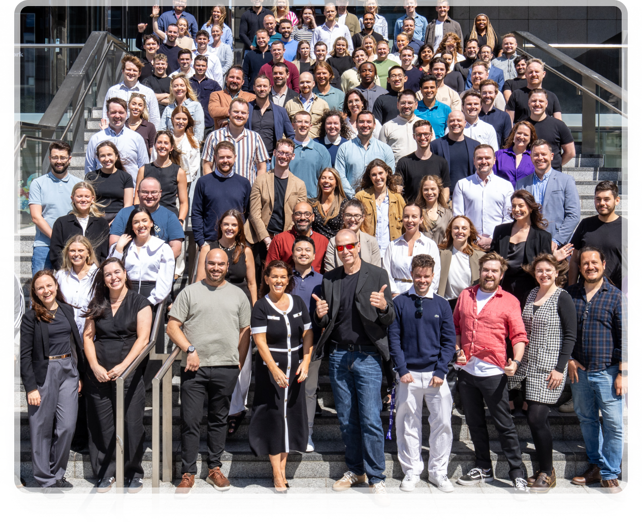 Group of people posing on stairs
