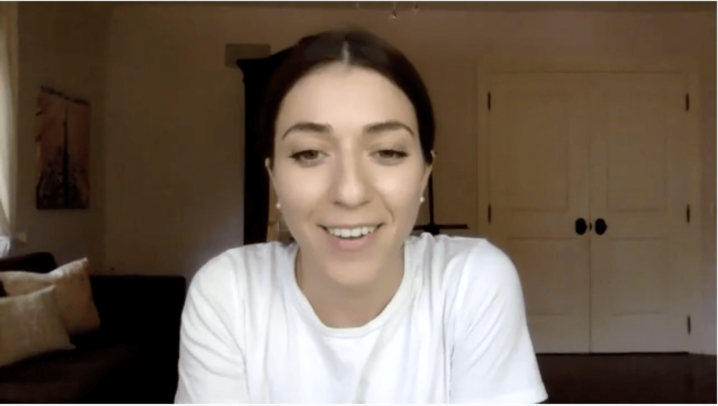 Woman smiling during video call in home office
