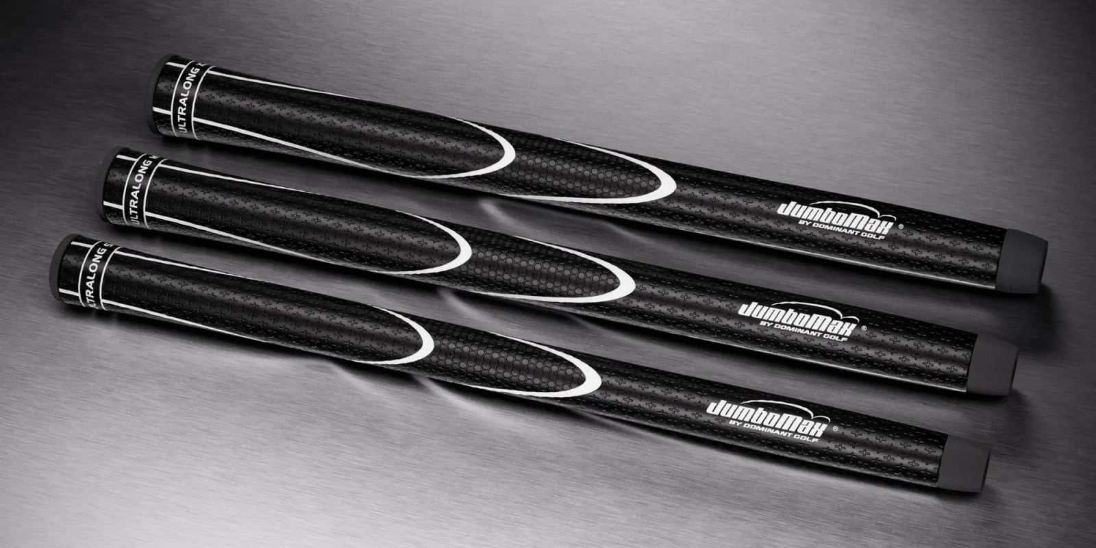Drie JumboMax JMX UltraLong-grips op een metalen ondergrond