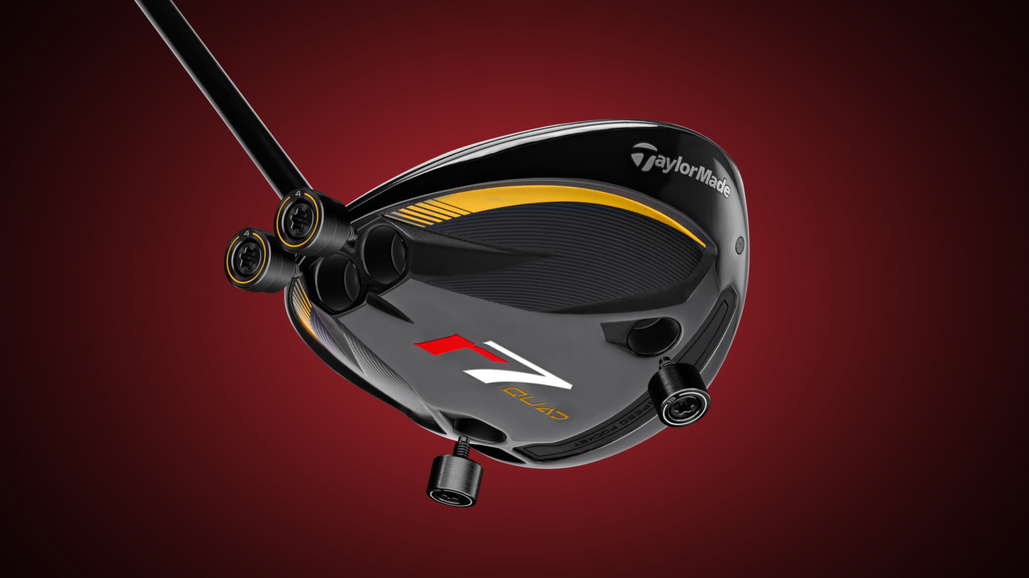 TaylorMade R7 Quad mini driver met losse gewichten op een rode achtergrond