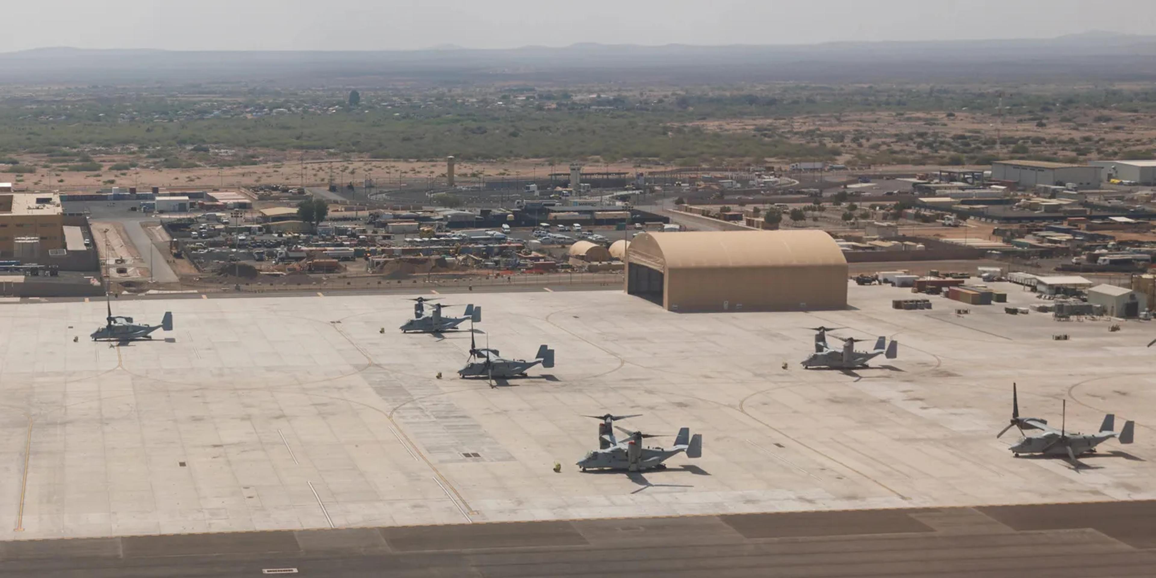 Aerial view of the Camp Lemonnier airfield, with tiltrotor aircraft parked on the apron