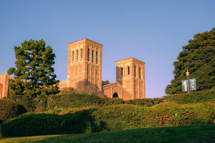 A building with two towers on top of a hill