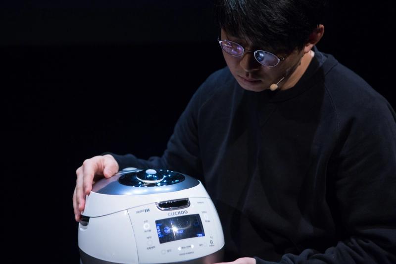 Man with a Cuckoo rice cooker