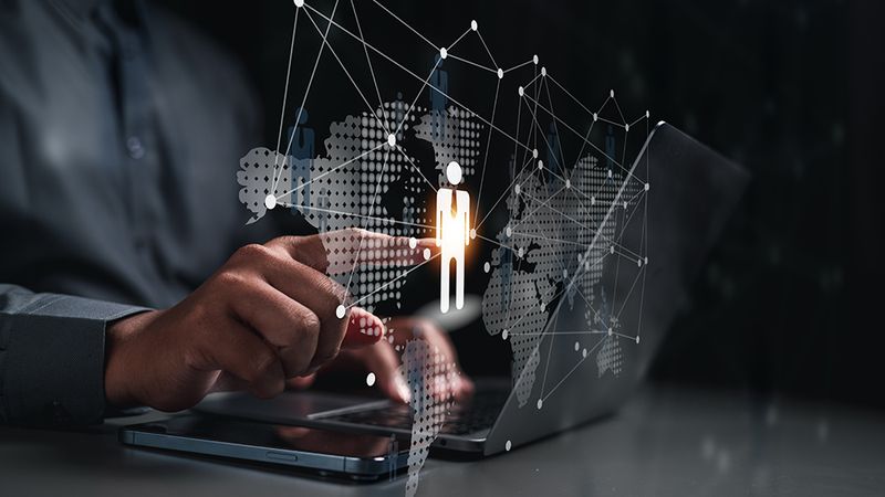 Business user selecting a workforce icon on a digital global network interface.