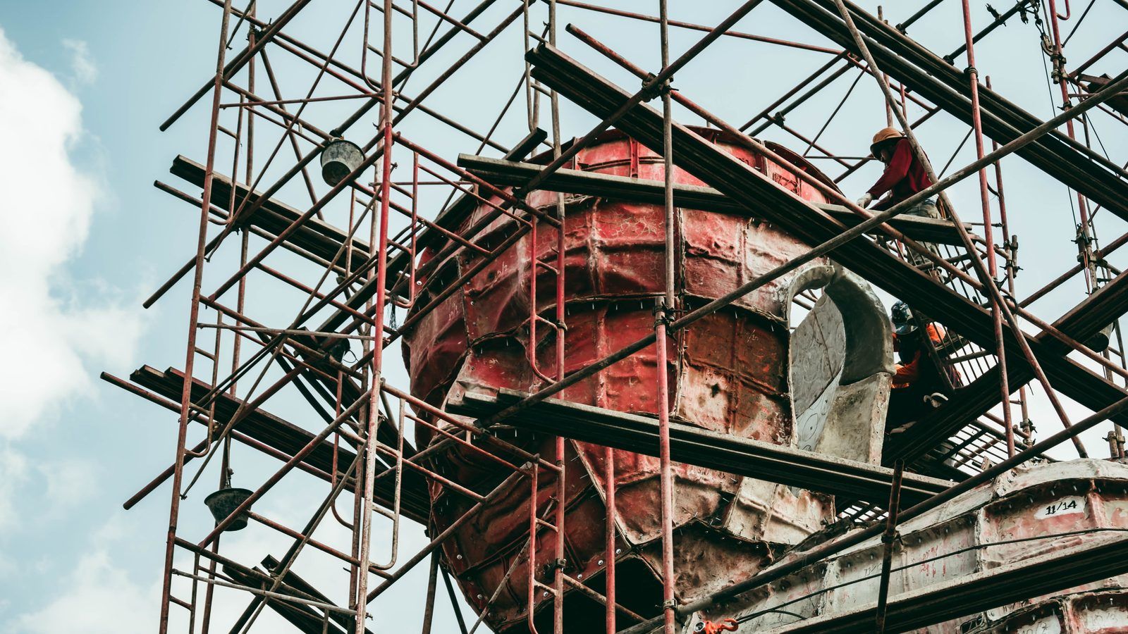 A construction crew reviewing job data on site