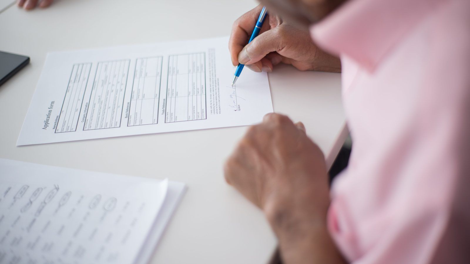 HR benefits and leave documentation on a desk