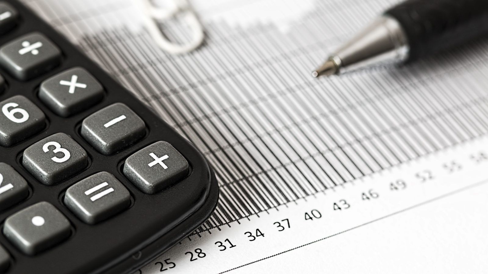 Reviewing payroll and timesheets with a calculator