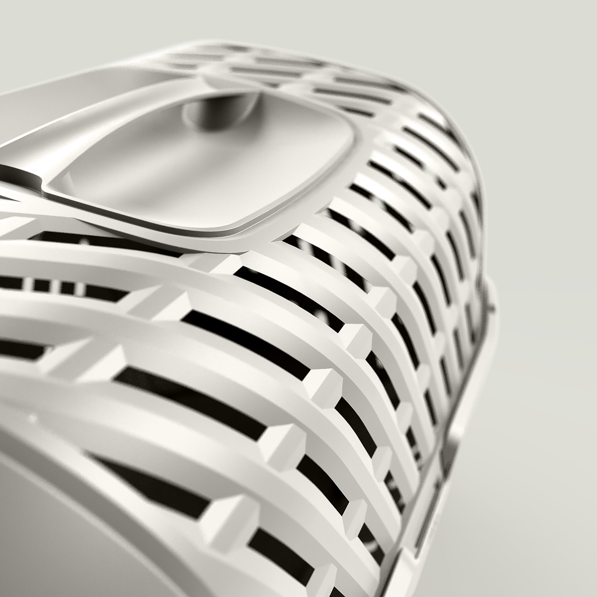 A stylish and practical transport cage with an openwork pattern, designed for safely transporting small pets with minimal environmental impact. Available at Maxi Zoo. Handle detail.
