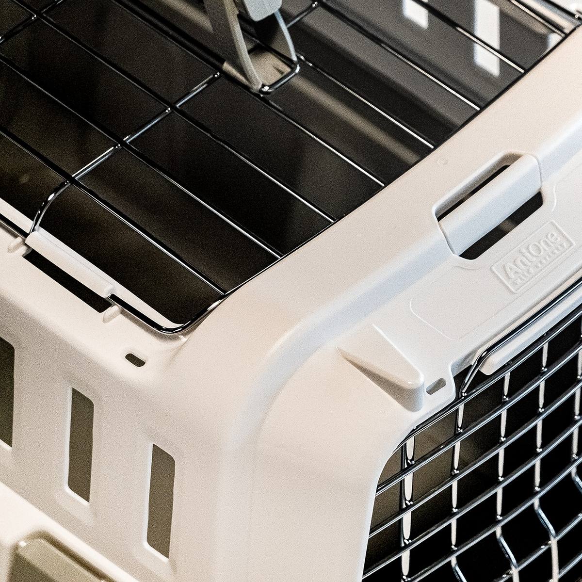 Odyssey pet carrier for dogs and cats by Moderna Products, IATA approved for air travel, open top design, available in 3 sizes, design for assembly, detail of door