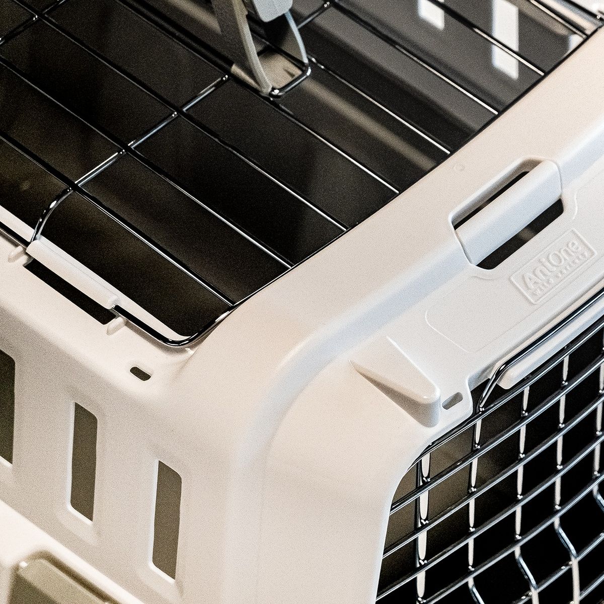 Odyssey pet carrier for dogs and cats by Moderna Products, IATA approved for air travel, open top design, available in 3 sizes, design for assembly, detail of door