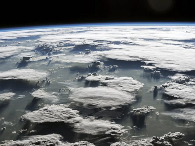 A satellite view from space of convective clouds viewed at a 45 degree angle from top-down