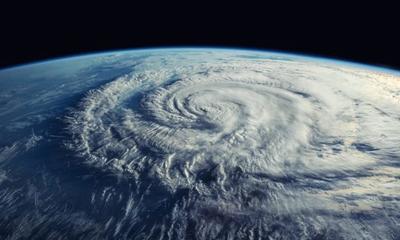 A satellite view from space of a hurricane viewed at about 45 degrees from top-down