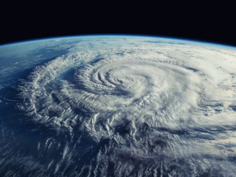 A satellite view from space of a hurricane viewed at about 45 degrees from top-down