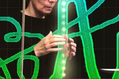 Artist and musician Marla Goodman drawing sound using a Theremin and ANS synthesizer