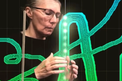Artist and musician Marla Goodman drawing sound using a Theremin and ANS synthesizer