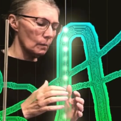 Artist and musician Marla Goodman drawing sound using a Theremin and ANS synthesizer