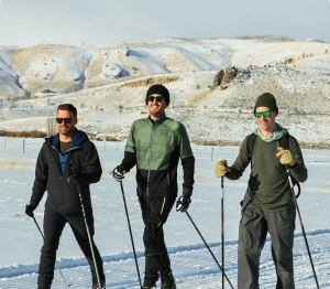 three people on skis outside
