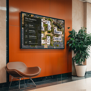 Mock up of a TV screen in a commercial hallway with a display of the property's energy usage statistics