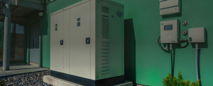 Battery storage unit next to a green wall
