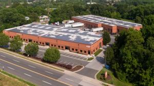 Image of two commercial buildings with solar panels covering their roofs