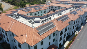 Image of solar panels on the roof of a senior living center