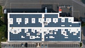 Aerial shot of solar panels on a commercial building