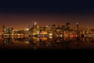 San Francisco skyline with iconic buildings and the Bay in the background.