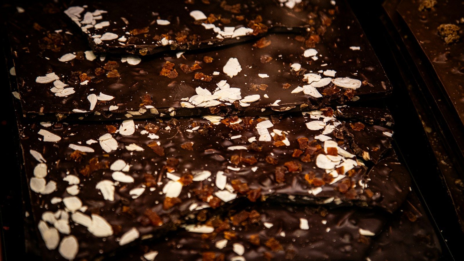 Carob bark pieces topped with coconut flakes