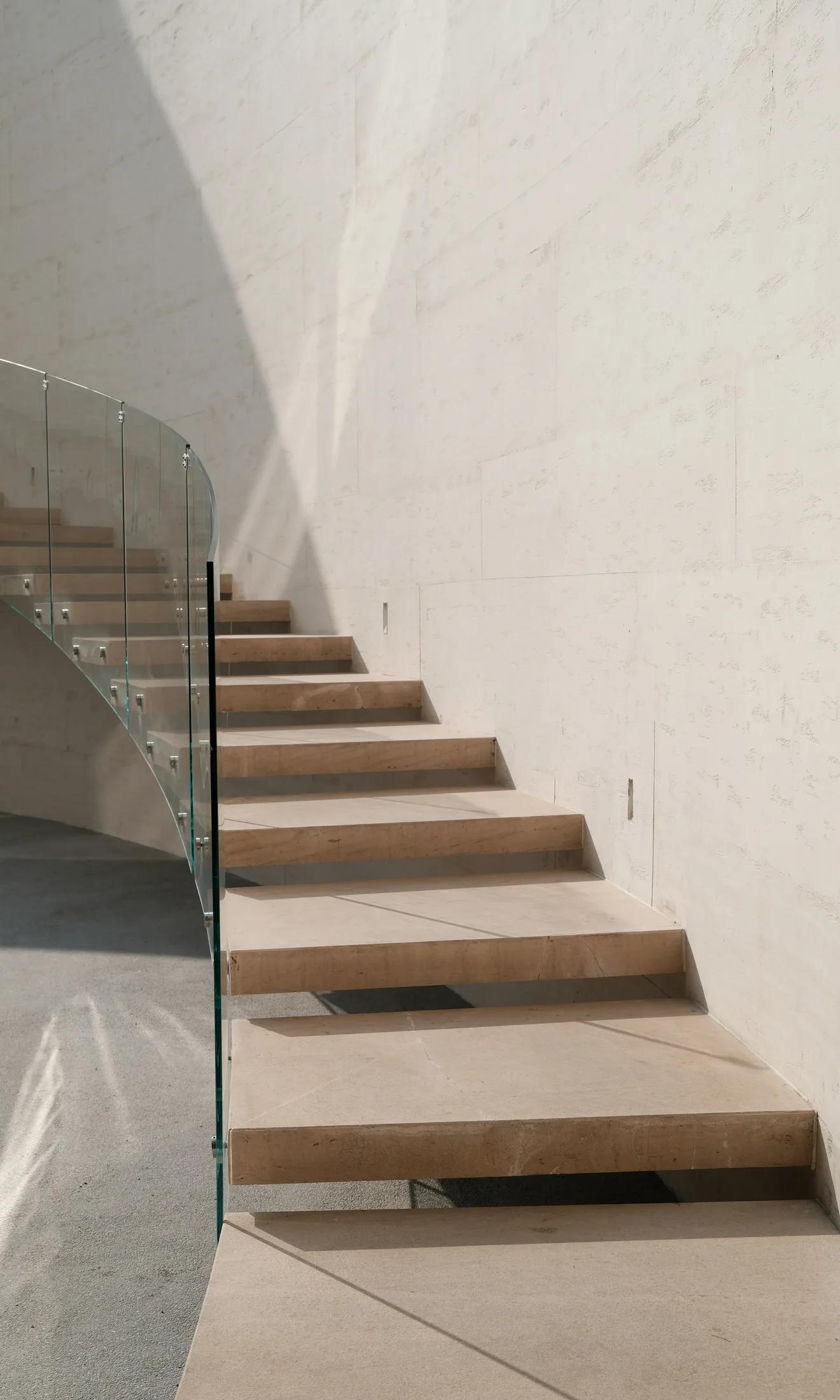 Minimal contemporary staircase with glass railing