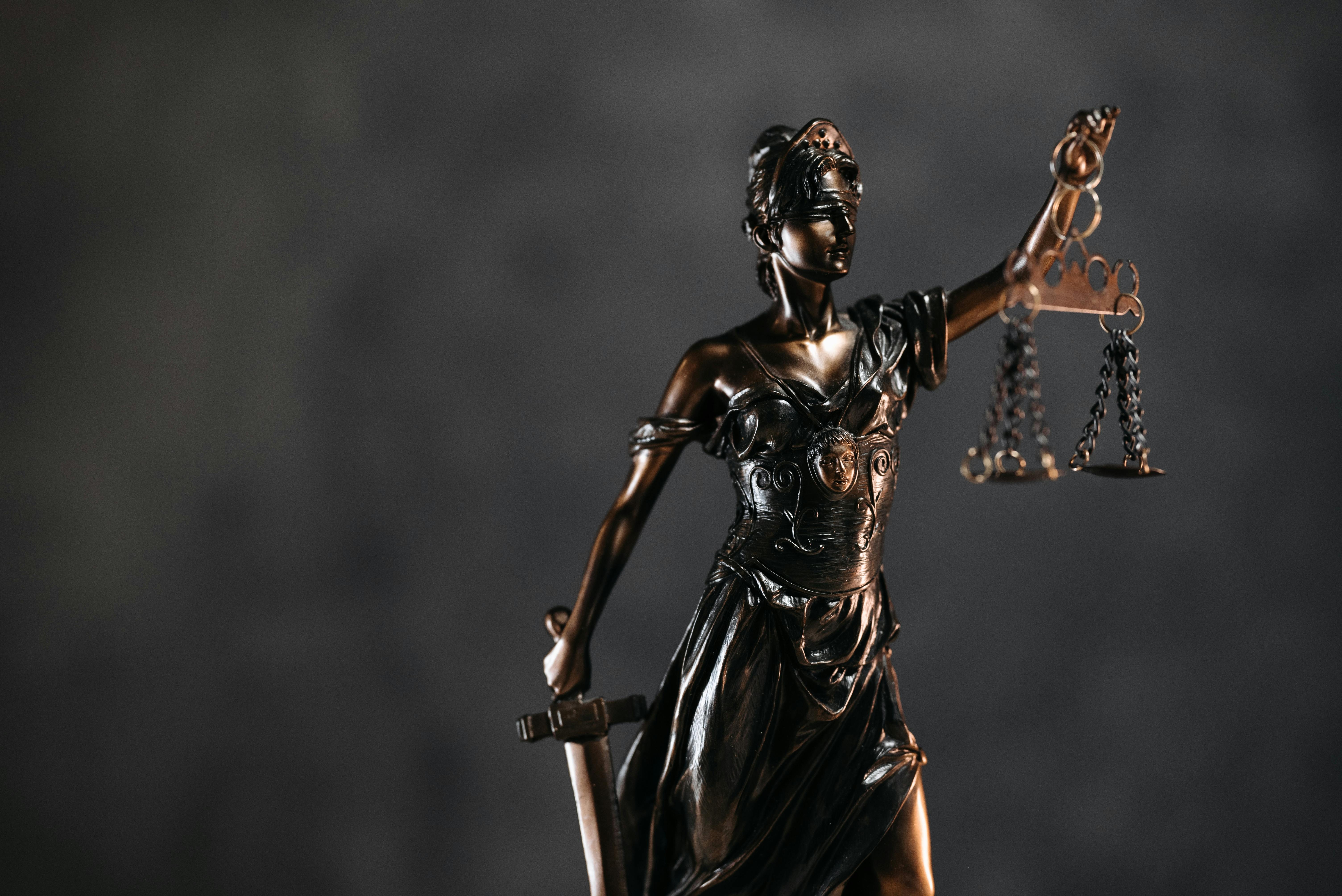 Image Lady Justice statue symbolizing the Roblox developer lawsuit against Roblox, Discord, and Uber over alleged child grooming, trafficking, and platform safety failures.